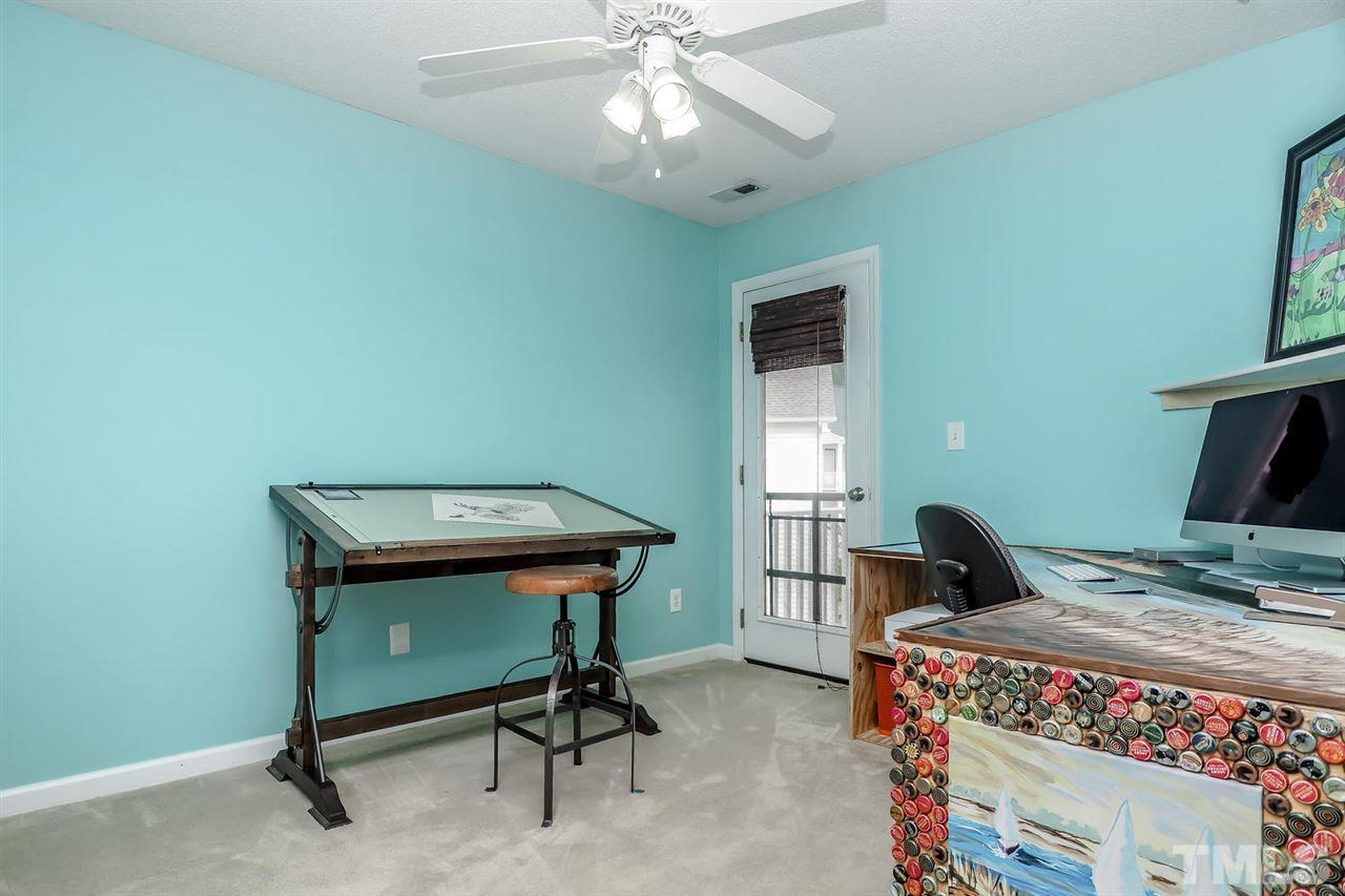 2341 Persimmon Ridge Drive Raleigh, NC 27604 - Photo 21 of 25 a bedroom with a bed and a desk