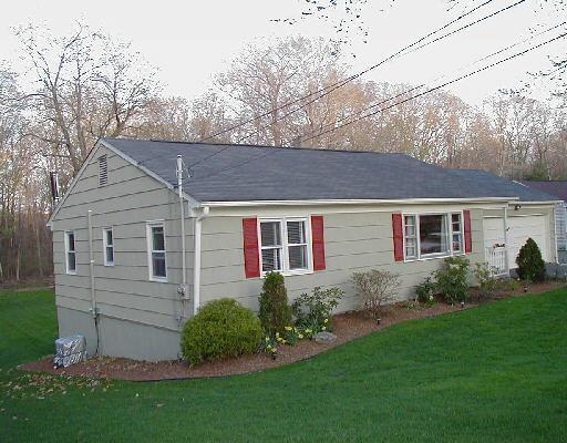 55 Dana Road Danbury, CT 06811 - Photo 1 of 1 a front view of a house with garden