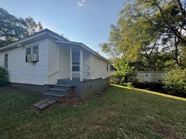 a backyard of a house with lots of green space