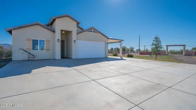 a view of a house with a street