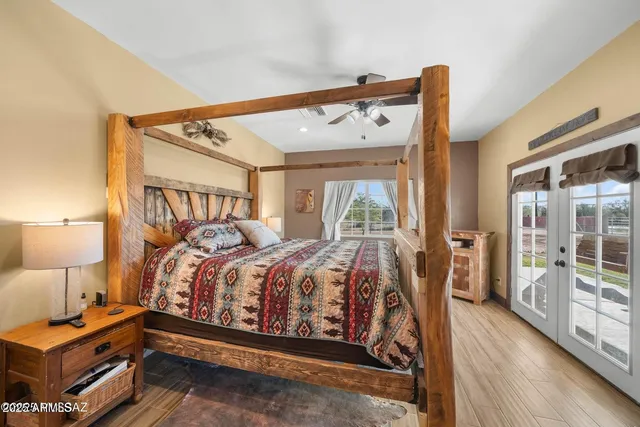 a bed room with a bed and a night stand