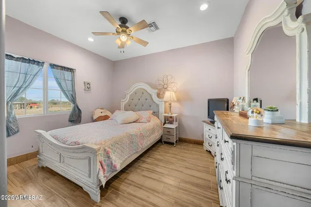 a bed room with a bed and a chandelier