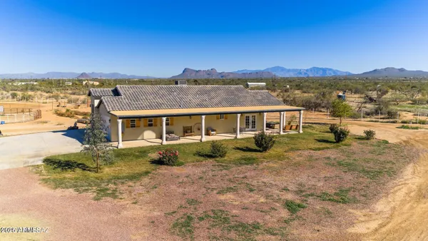 a view of a big house with a big yard