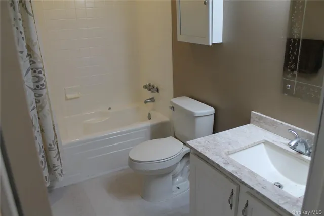 a view of a big room with wooden wall