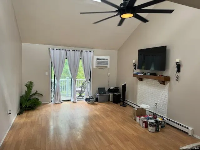 a view of a livingroom with furniture and a flat screen tv
