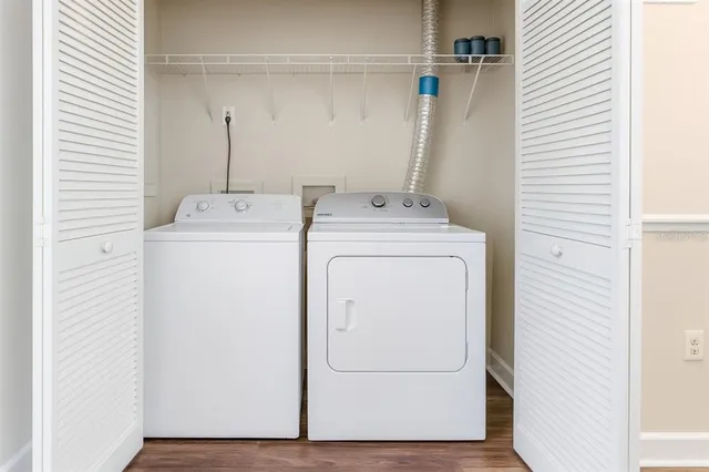 a utility room with dryer and washer
