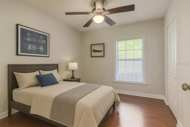 a bedroom with a bed and a window