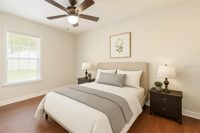 a bedroom with a bed and a window