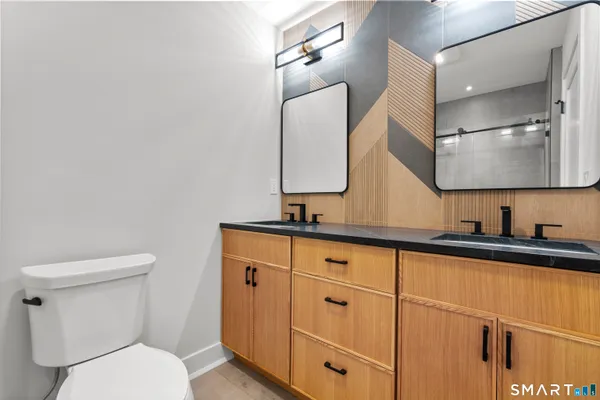a utility room with sink dryer and washer
