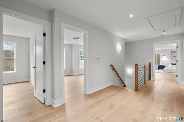 a spacious bedroom with a large bed and a large window