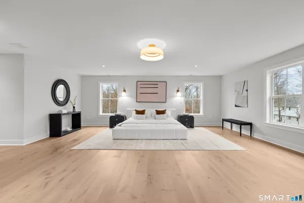 a bedroom with a bed and cabinets