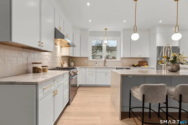 a kitchen with a sink cabinets and window