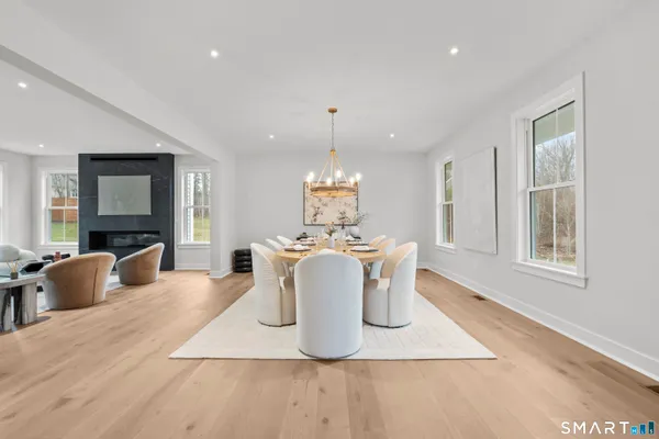 a view of a dining room with furniture window and wooden floor