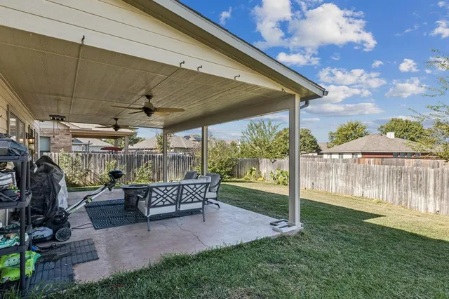 a view of backyard with green space