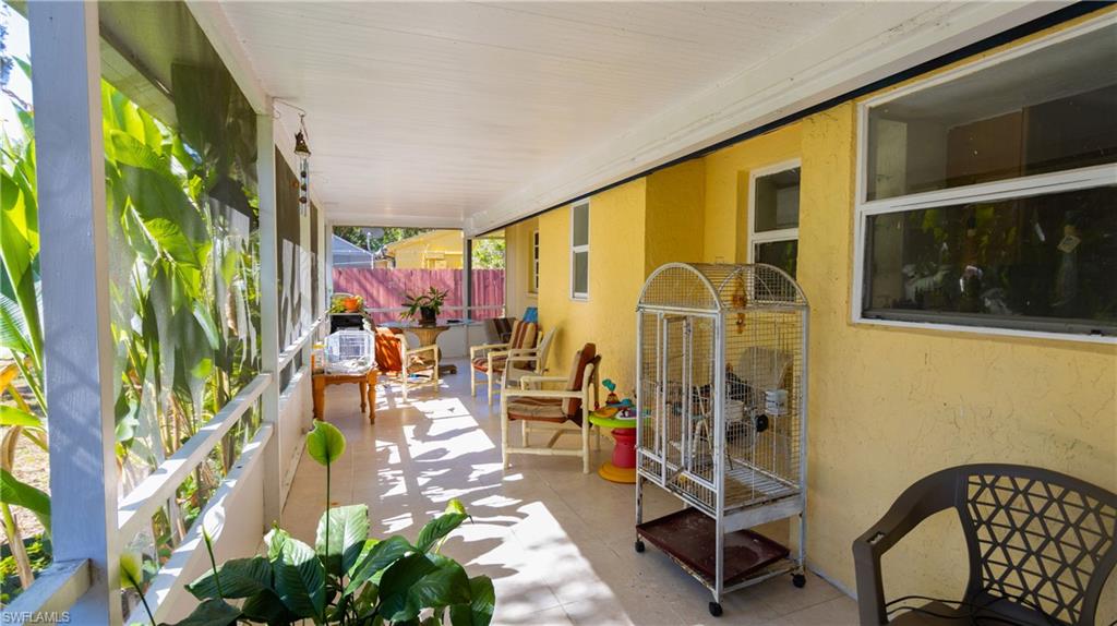 1230 Ramsdel Street Port Charlotte, FL 33952 - Photo 11 of 37 a view of a chairs and table in a balcony