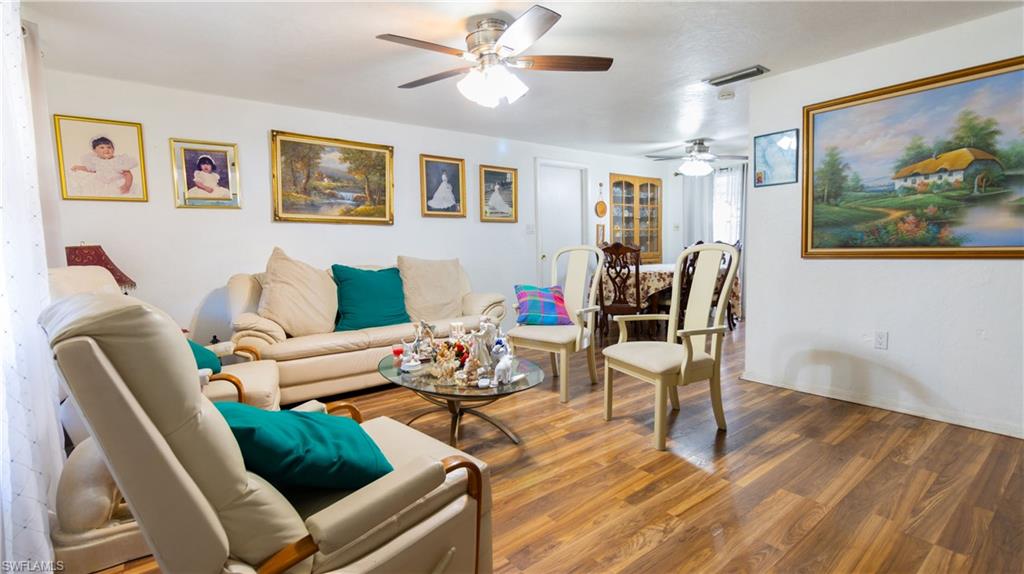 1230 Ramsdel Street Port Charlotte, FL 33952 - Photo 18 of 37 a living room with furniture and wooden floor