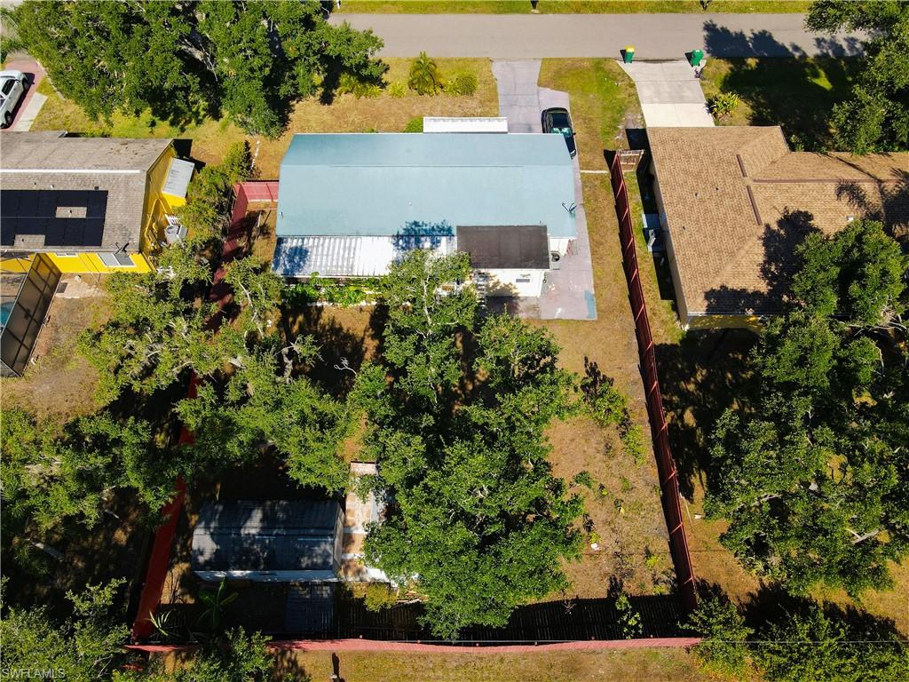 1230 Ramsdel Street Port Charlotte, FL 33952 - Photo 35 of 37 an aerial view of a house with a yard and trees