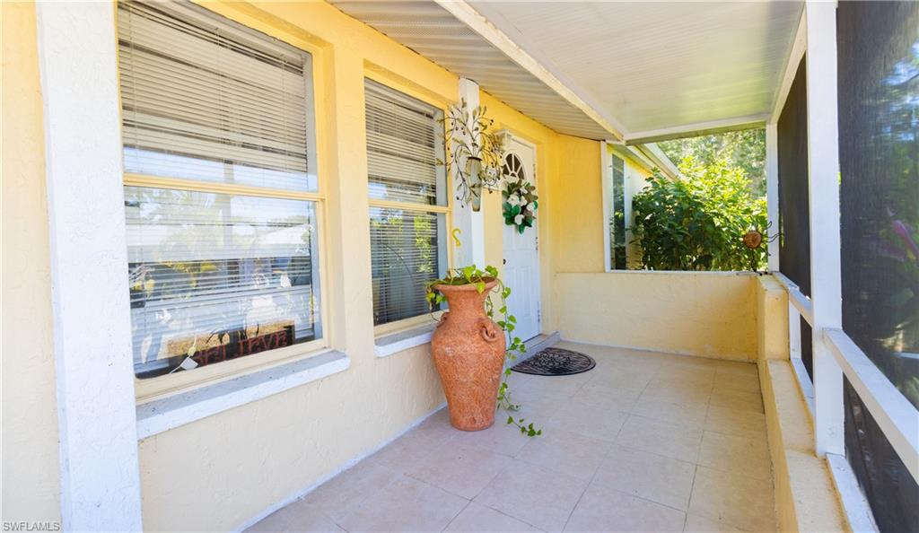 1230 Ramsdel Street Port Charlotte, FL 33952 - Photo 4 of 37 a view of a porch with furniture