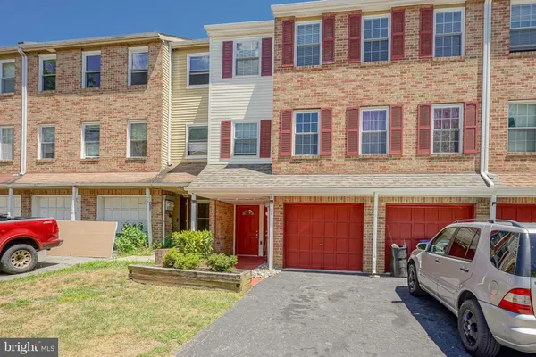 a front view of a building with parking space