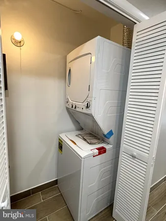 a bathroom with a sink toilet and mirror