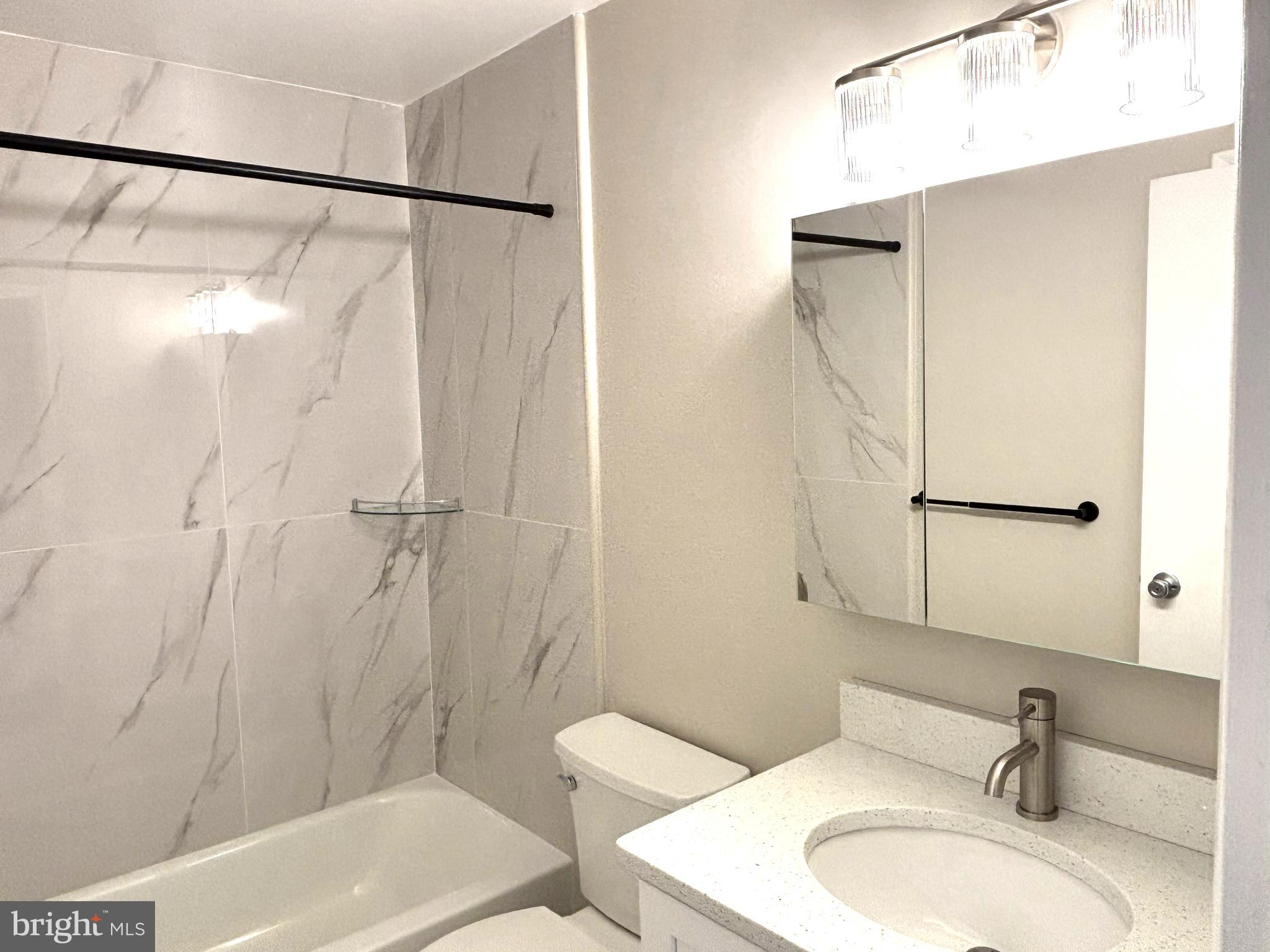 104 Chaucer Road, Unit A Mount Laurel, NJ 08054 - Photo 15 of 20 a bathroom with a sink and a mirror