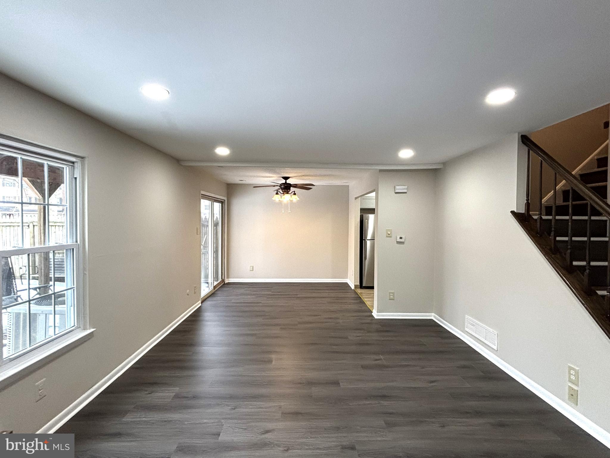 104 Chaucer Road, Unit A Mount Laurel, NJ 08054 - Photo 6 of 20 a view of empty room with wooden floor and fan