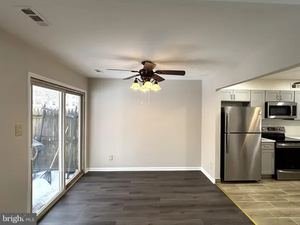 a view of a livingroom with a ceiling fan