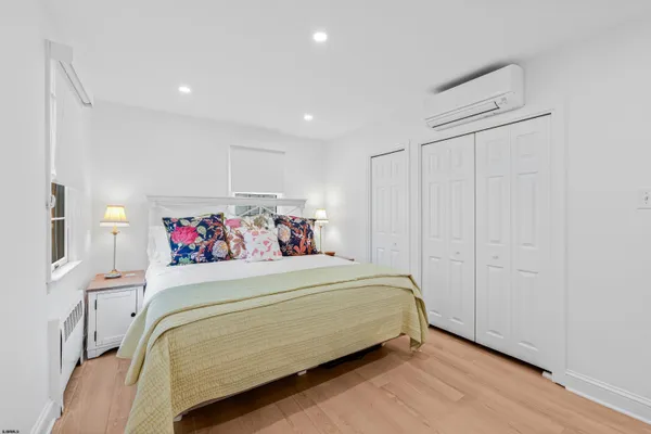 a bedroom with a bed and a closet