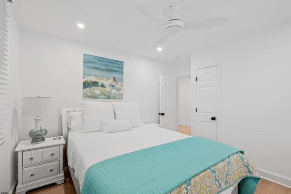 a bedroom with a bed and a lamp