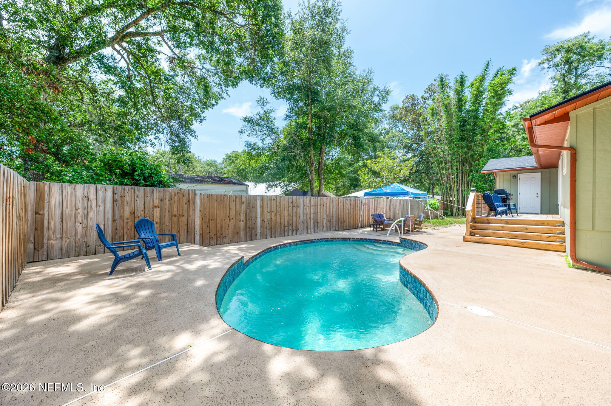 507 Gentian Road St. Augustine, FL 32086 - Photo 40 of 82 a backyard of a house with table and chairs