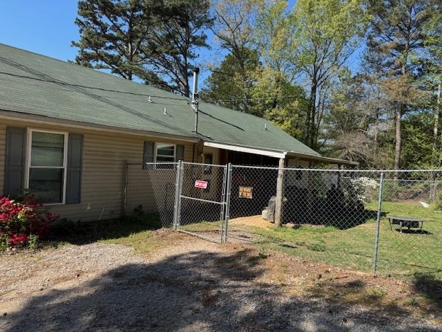 View of home's exterior featuring a gate