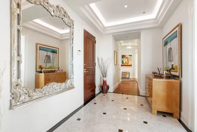 a living room with furniture a rug and a flat screen tv