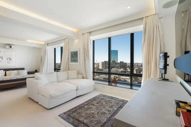 a living room with furniture and a rug