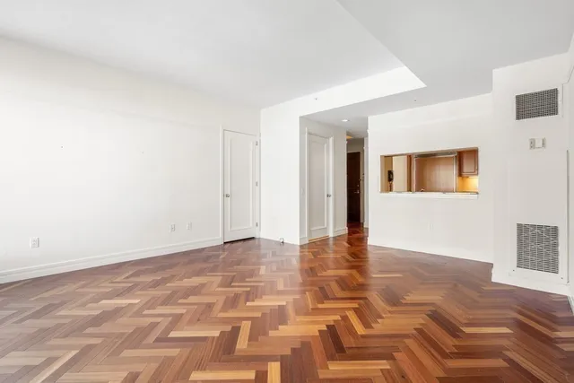 a view of a hallway with a kitchen