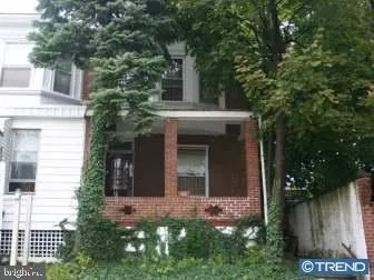 front view of a house with a small yard