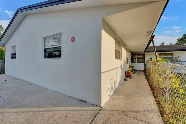 a view of a hallway with wooden walls
