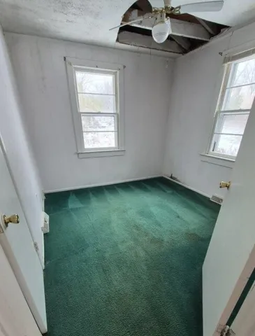 a view of room with window and ceiling fan