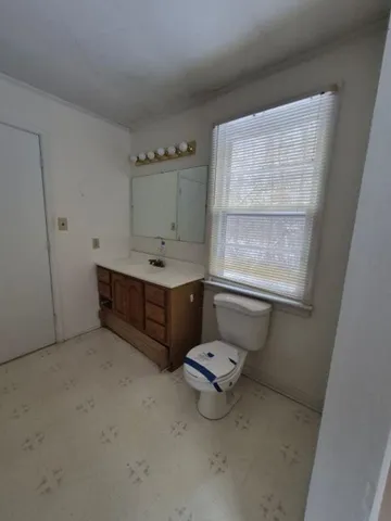 a room with a window and mirror