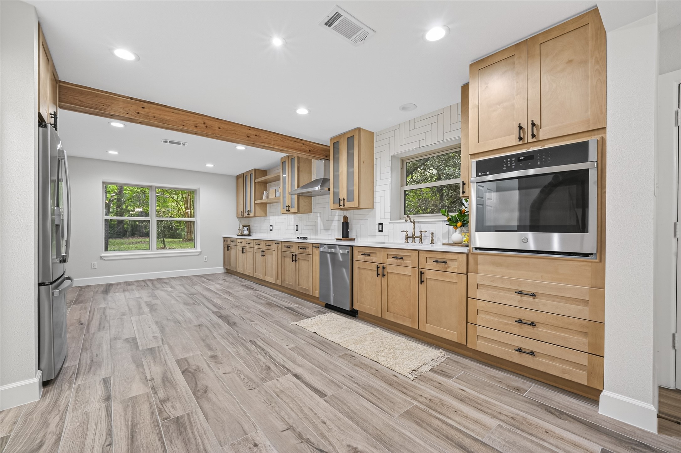 23607 Cardinal Drive Hockley, TX 77447 - Photo 17 of 50 Wide windows and strategically placed recessed lighting ensure every corner of the food preparation zone is bright and inviting.