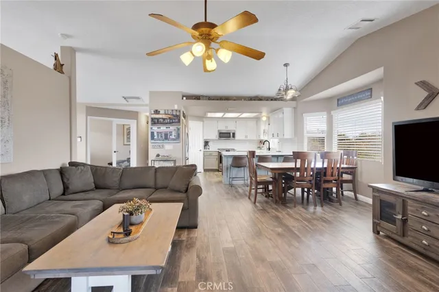 a kitchen with cabinets appliances a sink and a window