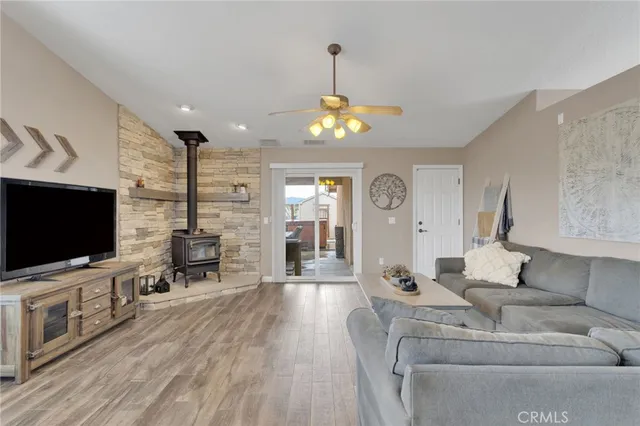 a bedroom with a bed and a flat tv screen on dresser