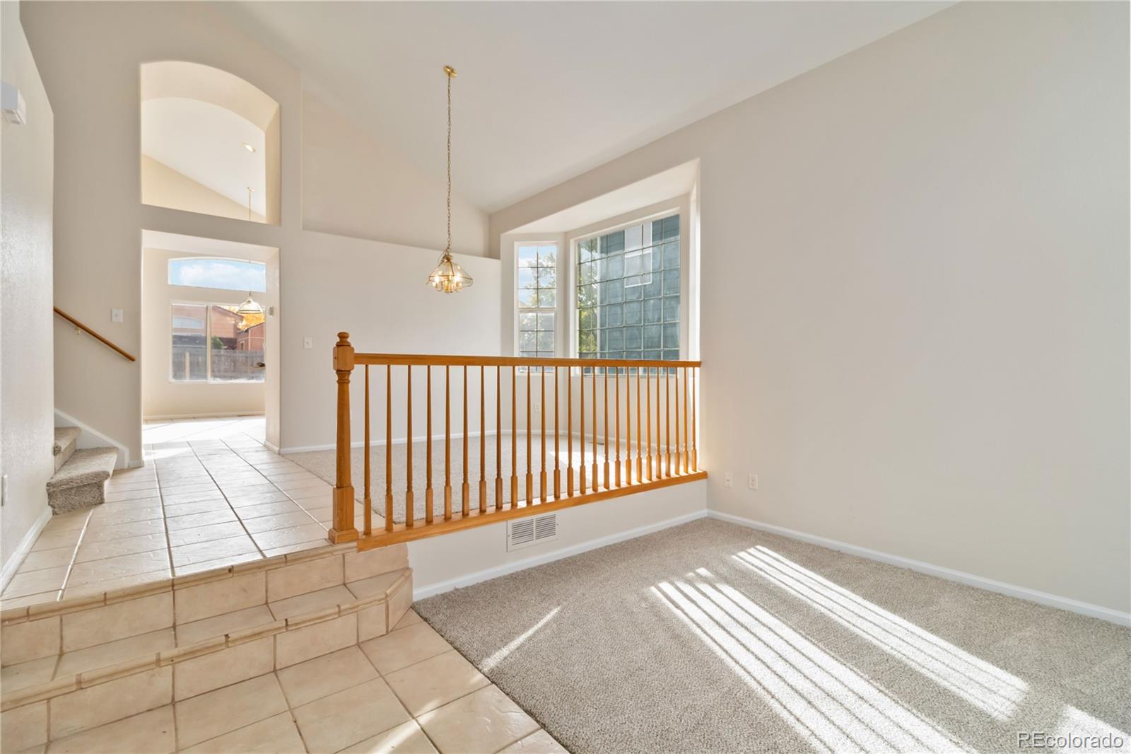 5124 Enid Way Denver, CO 80239 - Photo 11 of 47 a view of a livingroom with wooden floor and a window
