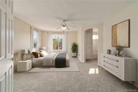 a view of empty room with a ceiling fan
