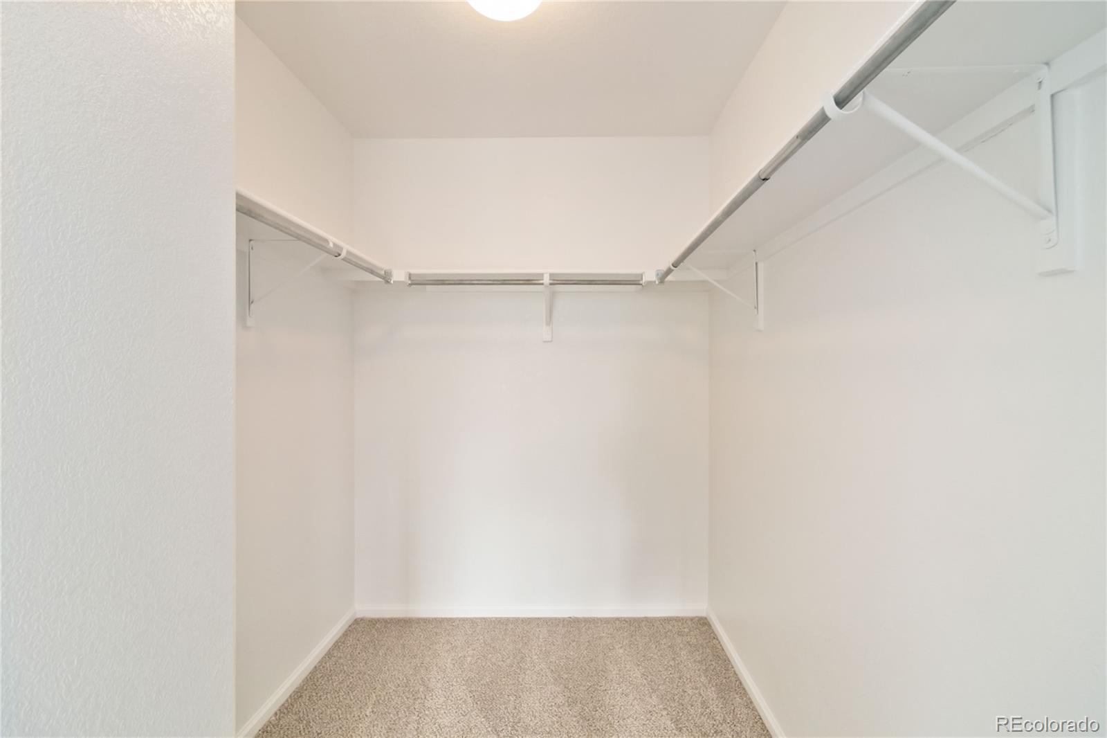 5124 Enid Way Denver, CO 80239 - Photo 28 of 47 a view of an empty walk in closet