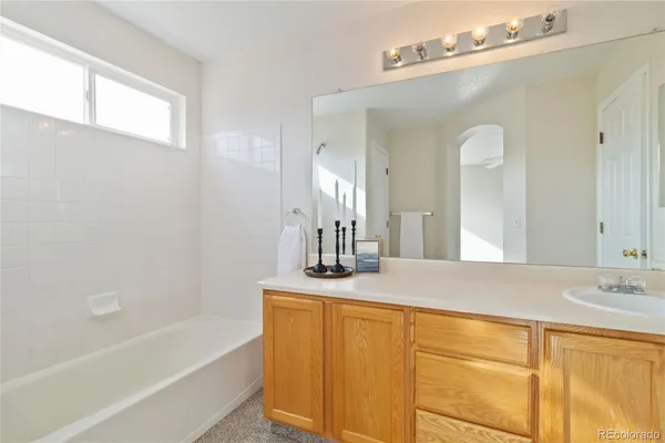 a view of a bathroom with a shower and a tub