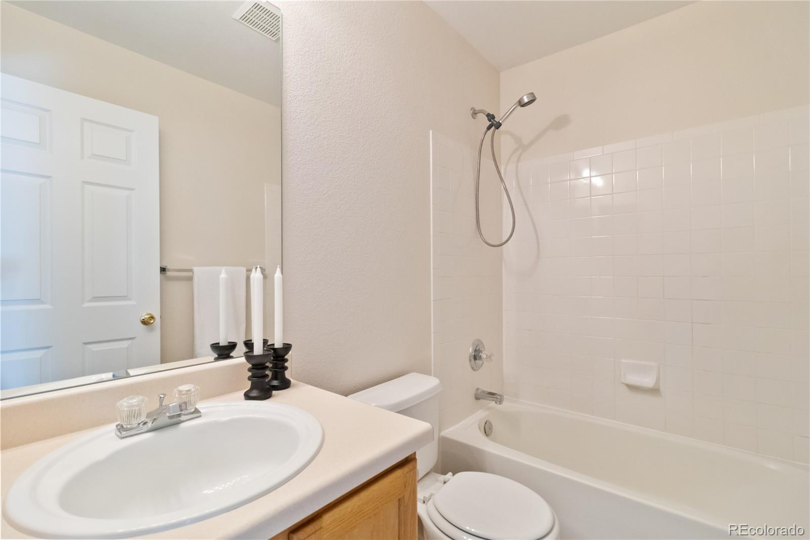 5124 Enid Way Denver, CO 80239 - Photo 35 of 47 a bathroom with a sink toilet and shower