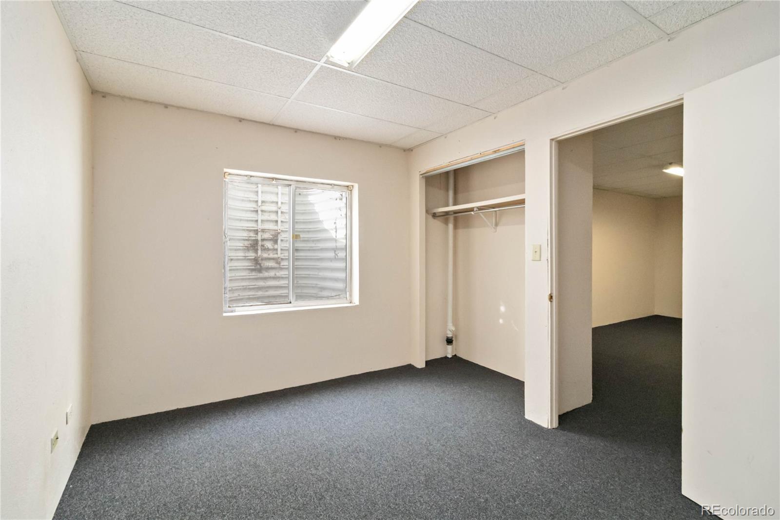 5124 Enid Way Denver, CO 80239 - Photo 39 of 47 a view of an empty room with a window