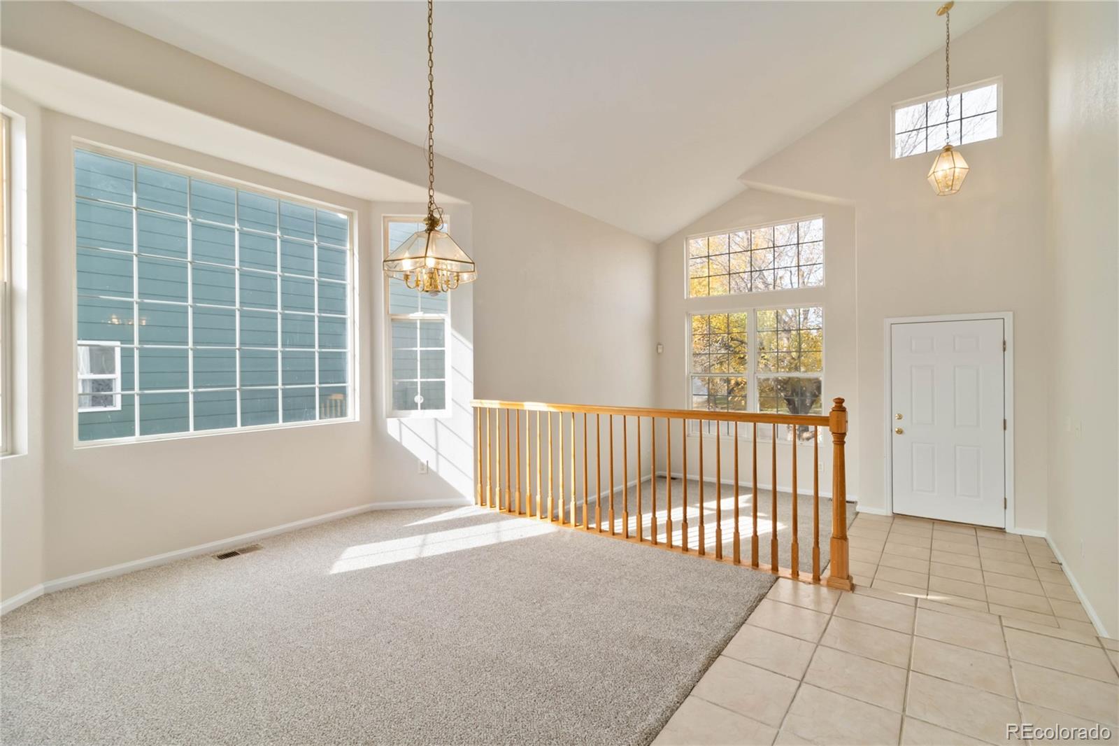 5124 Enid Way Denver, CO 80239 - Photo 7 of 47 a view of an empty room with a window