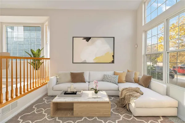 a living room with furniture and a window with outer view