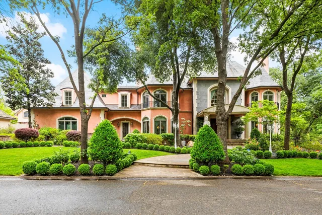 front view of a house with a garden